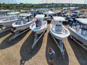 Sea Fox Boats for sale displayed at Tampa Boat show with new owners posing on Sea Fox Boat