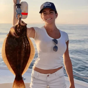 girl holding flounder