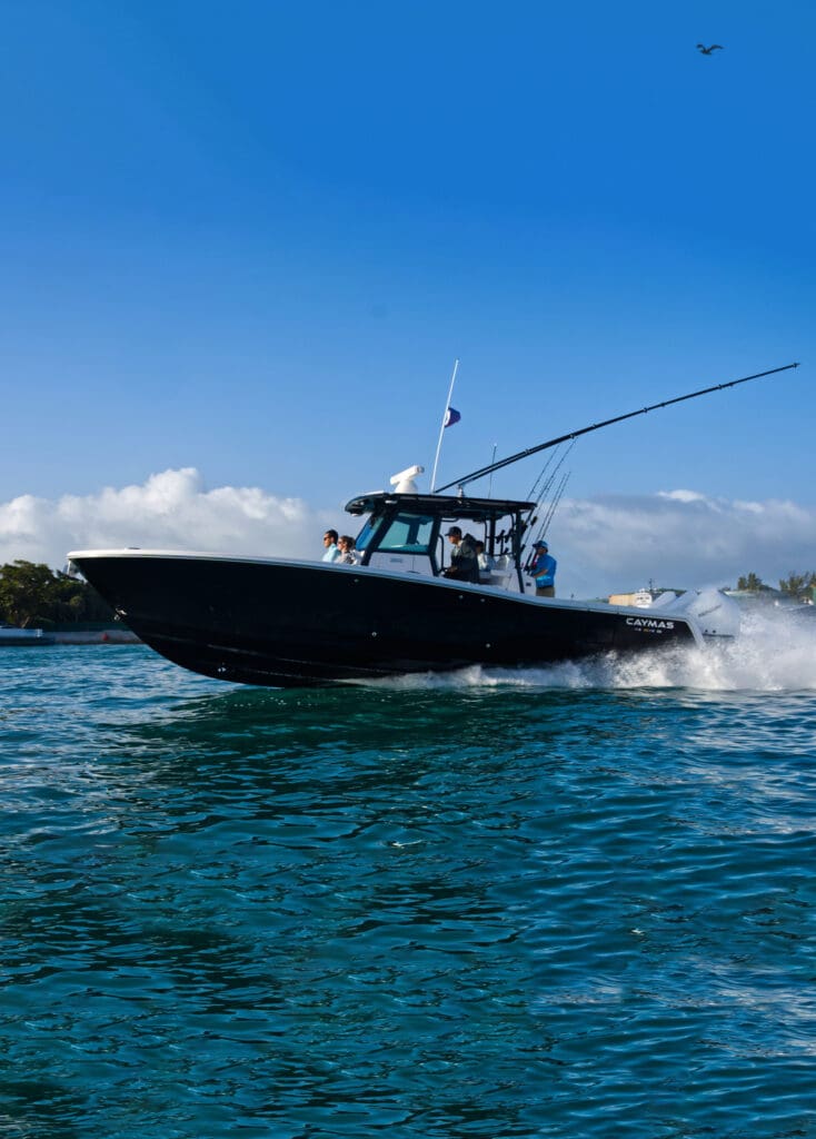 mobile caymas 341 center console boat speeding through the bay caymas center console for sale