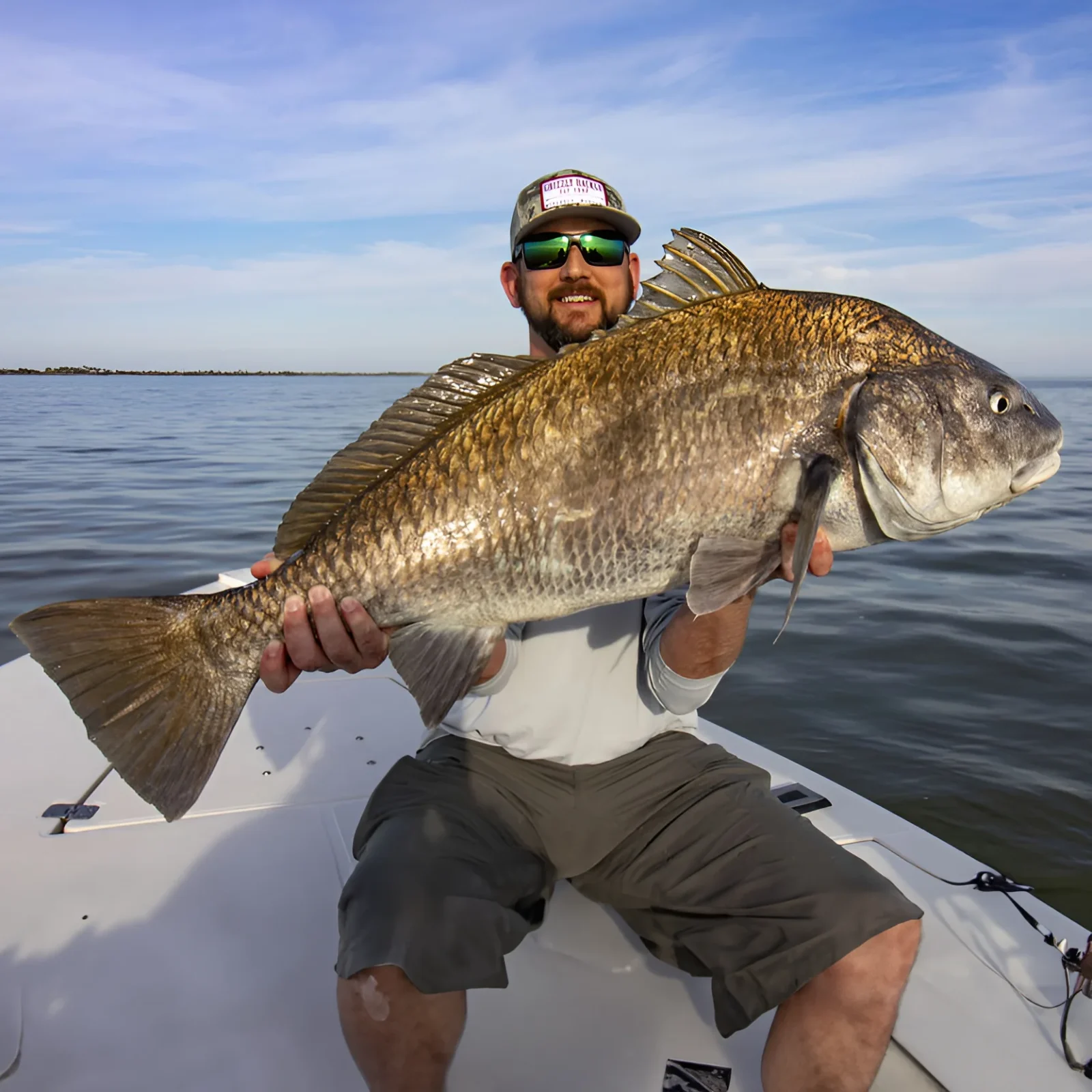 man holding black drum